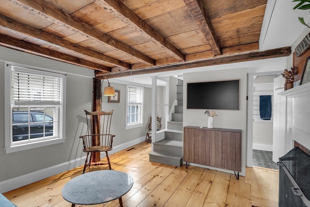 16 River Street Salem, MA 01970 - Photo 13 of 37 a living room with furniture and a flat screen tv