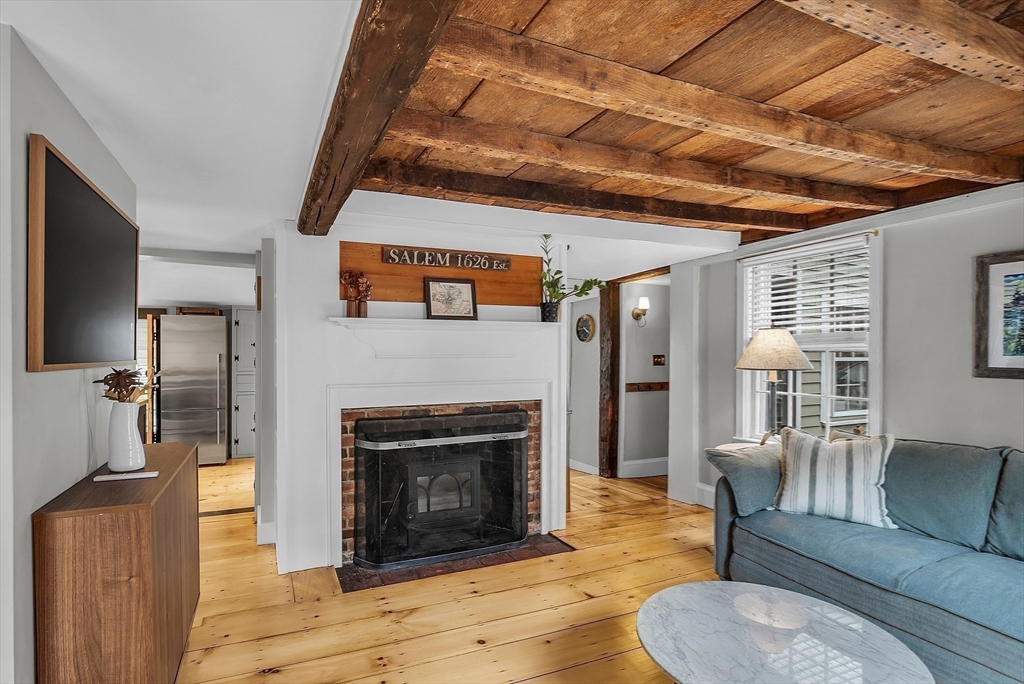 16 River Street Salem, MA 01970 - Photo 15 of 37 a living room with furniture and a fireplace