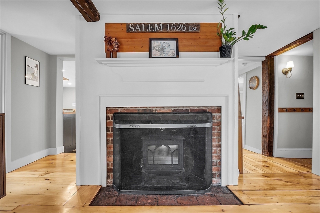 16 River Street Salem, MA 01970 - Photo 16 of 37 a living room with a fireplace in it