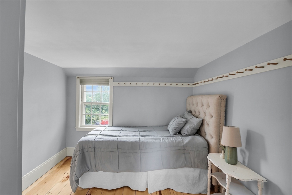 16 River Street Salem, MA 01970 - Photo 19 of 37 a bedroom with a bed and window