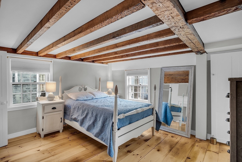 16 River Street Salem, MA 01970 - Photo 25 of 37 a bedroom with a bed and a large window with balcony view