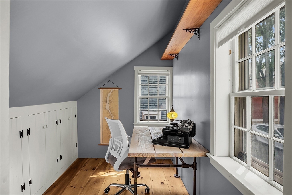 16 River Street Salem, MA 01970 - Photo 28 of 37 a view of a workspace with furniture and a window