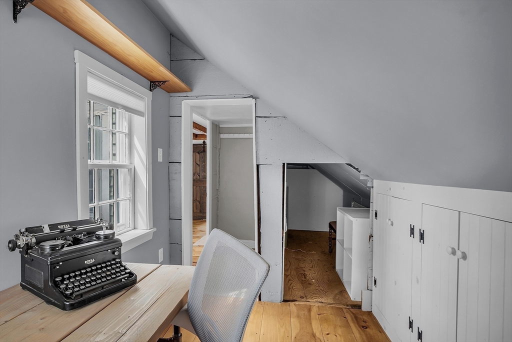 16 River Street Salem, MA 01970 - Photo 29 of 37 a living room with furniture and a fireplace