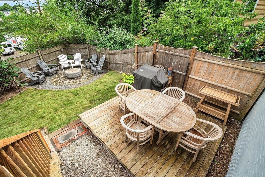 16 River Street Salem, MA 01970 - Photo 32 of 37 a backyard of a house with dining table and chairs