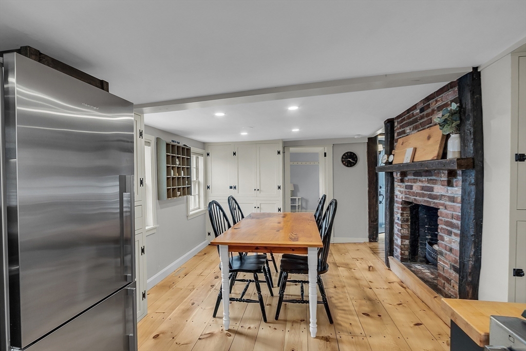 16 River Street Salem, MA 01970 - Photo 8 of 37 a dining room with furniture and fireplace