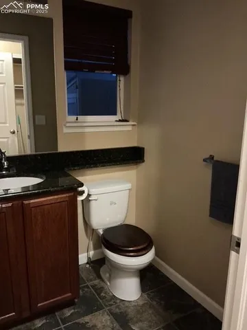 a bathroom with a toilet and a sink