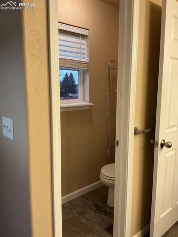 a bathroom with a toilet