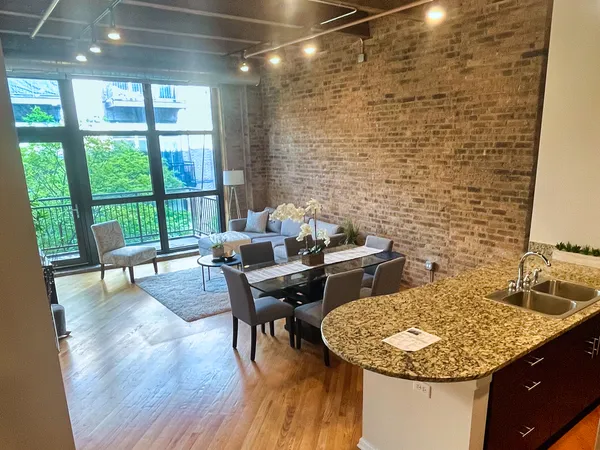 a dining room with furniture and wooden floor