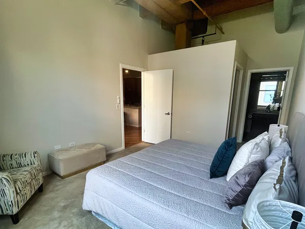 a bedroom with two beds and a couch