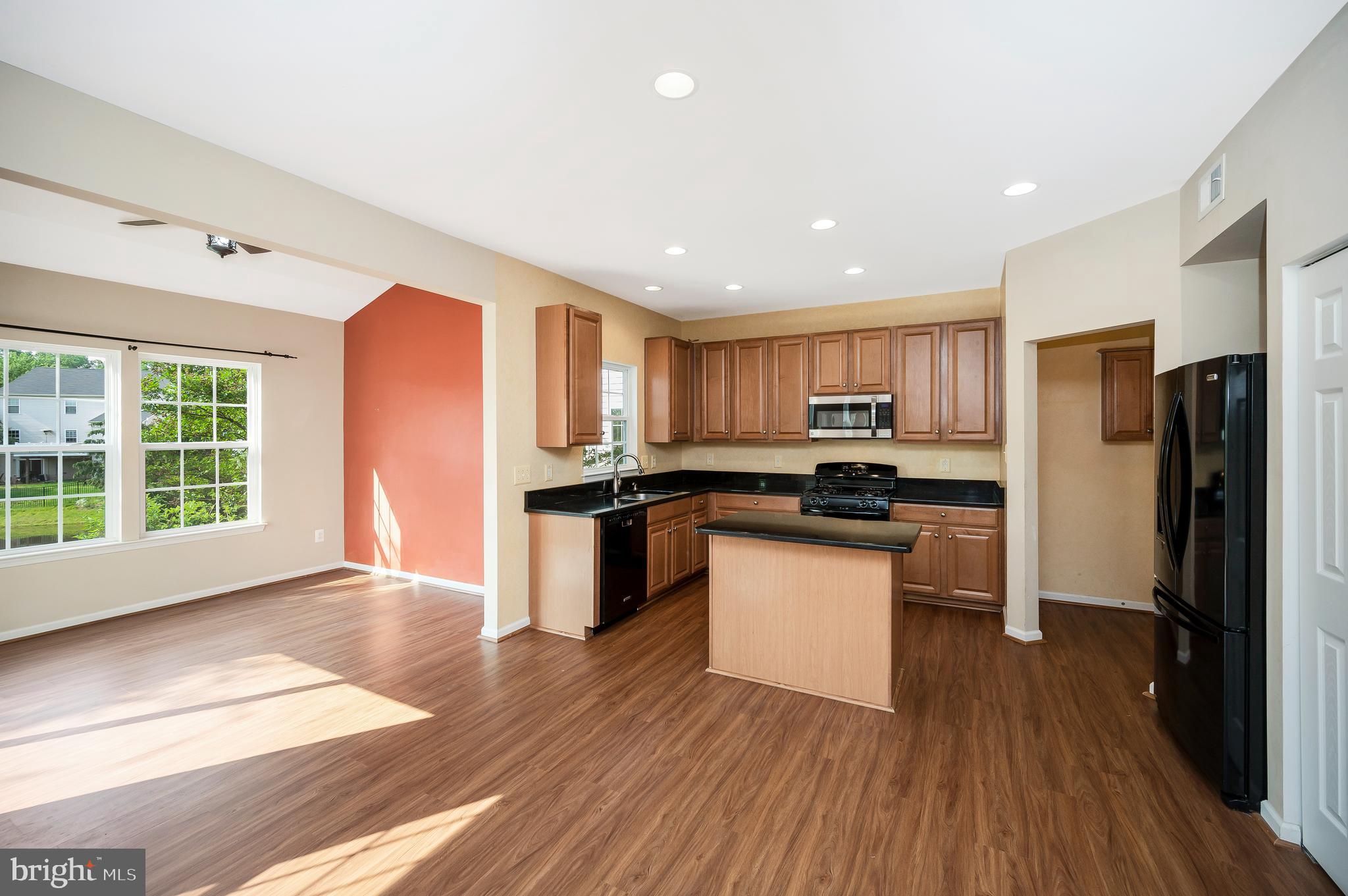 3308 Boathouse Road Warrenton, VA 20187 - Photo 11 of 59 a kitchen with a refrigerator and a stove top oven