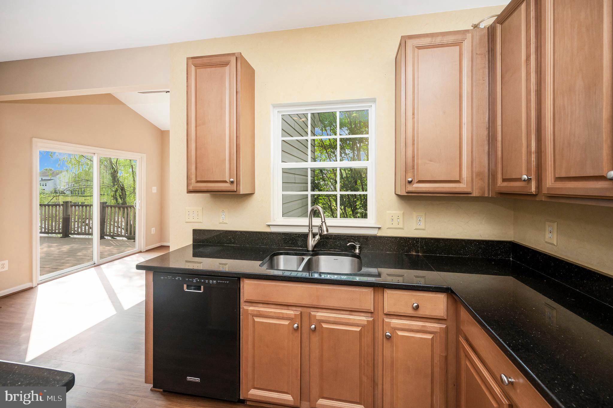 3308 Boathouse Road Warrenton, VA 20187 - Photo 16 of 59 a kitchen with granite countertop cabinets sink and window