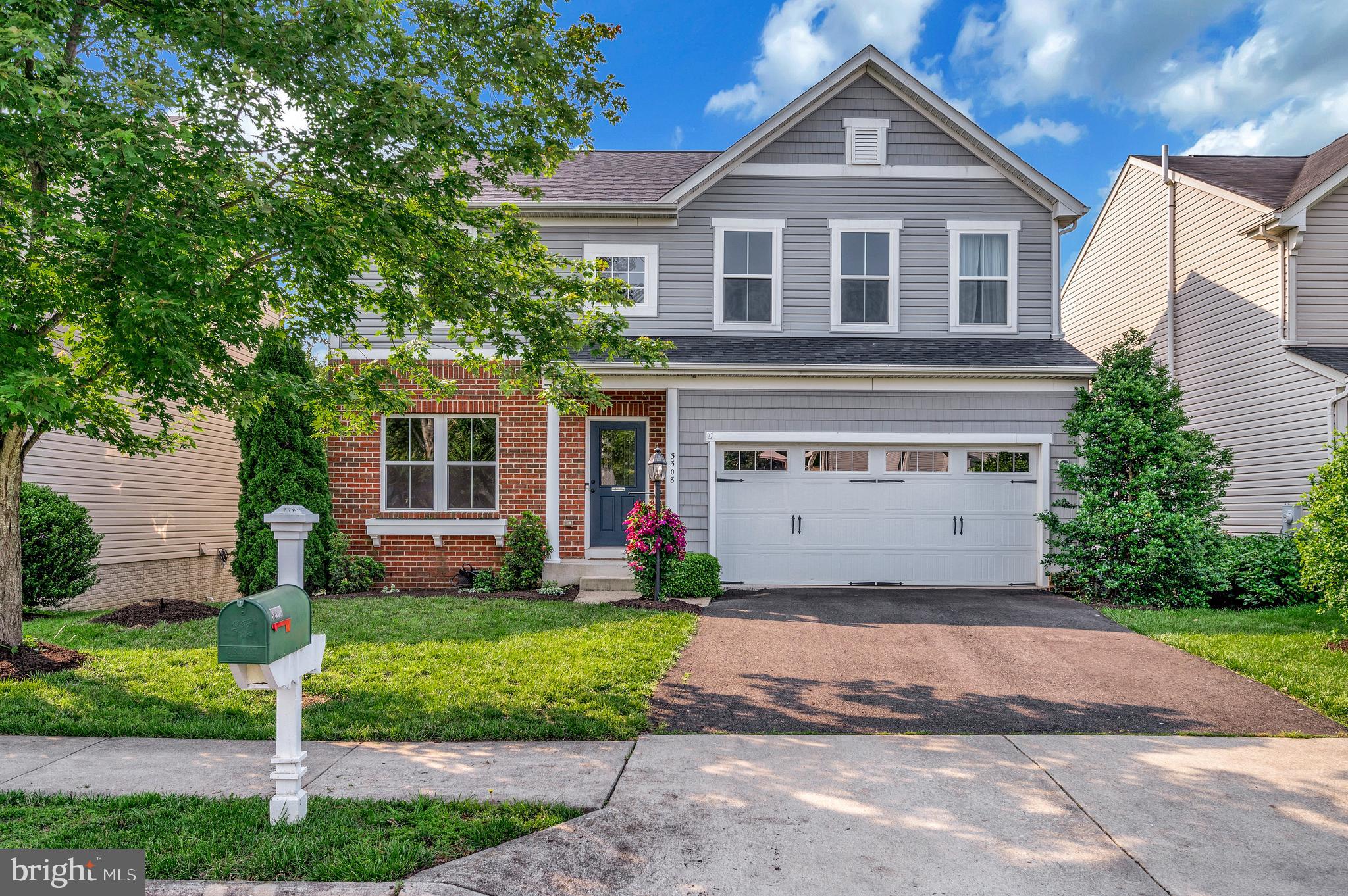 3308 Boathouse Road Warrenton, VA 20187 - Photo 2 of 59 a front view of a house with a yard and garage