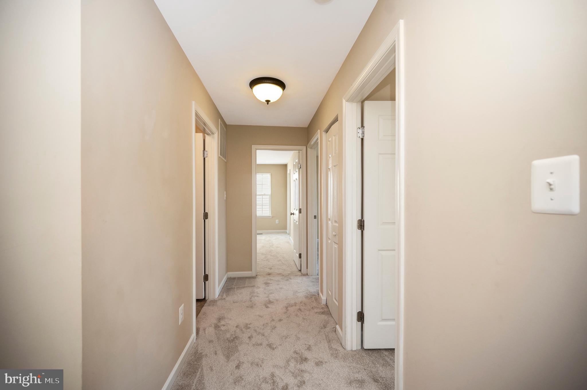3308 Boathouse Road Warrenton, VA 20187 - Photo 22 of 59 a view of a hallway with wooden floor