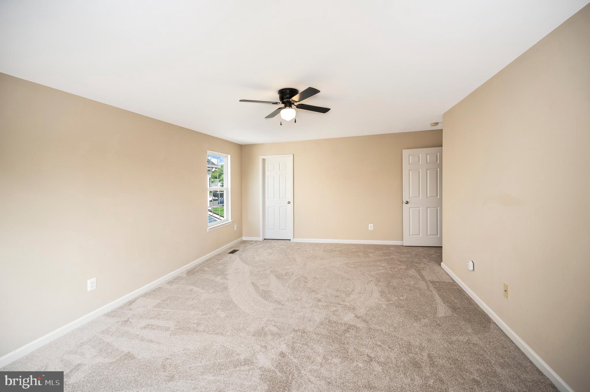 3308 Boathouse Road Warrenton, VA 20187 - Photo 26 of 59 an empty room with a ceiling fan and carpet