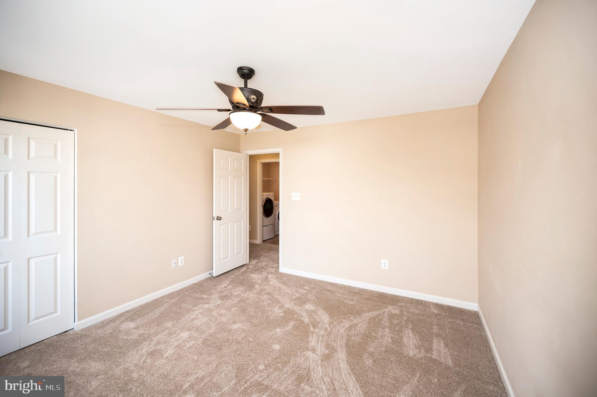 3308 Boathouse Road Warrenton, VA 20187 - Photo 31 of 59 a view of a chandelier fan and closet in a room
