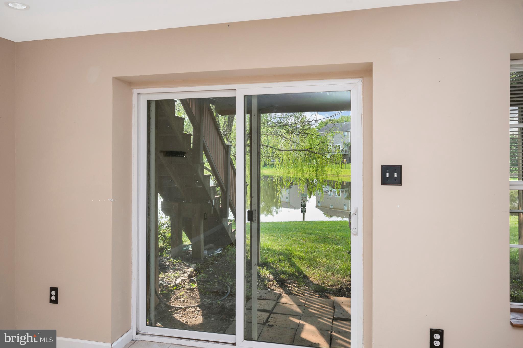 3308 Boathouse Road Warrenton, VA 20187 - Photo 39 of 59 a view of a glass door and a yard