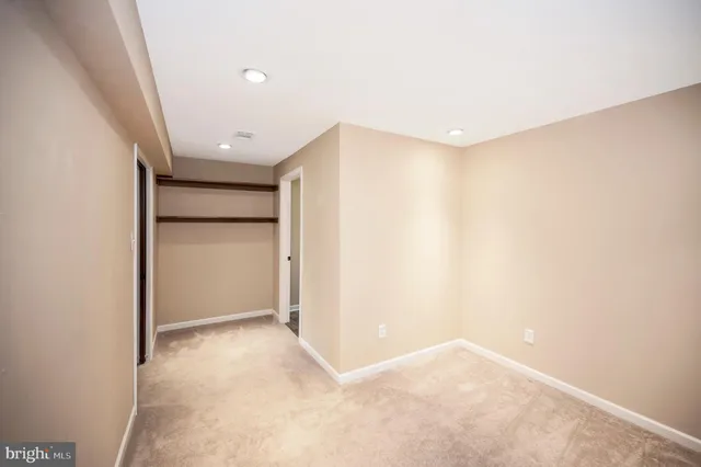 a view of a house with a yard and a garden