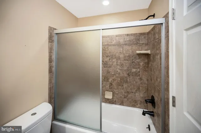 a view of a lake with houses in the back