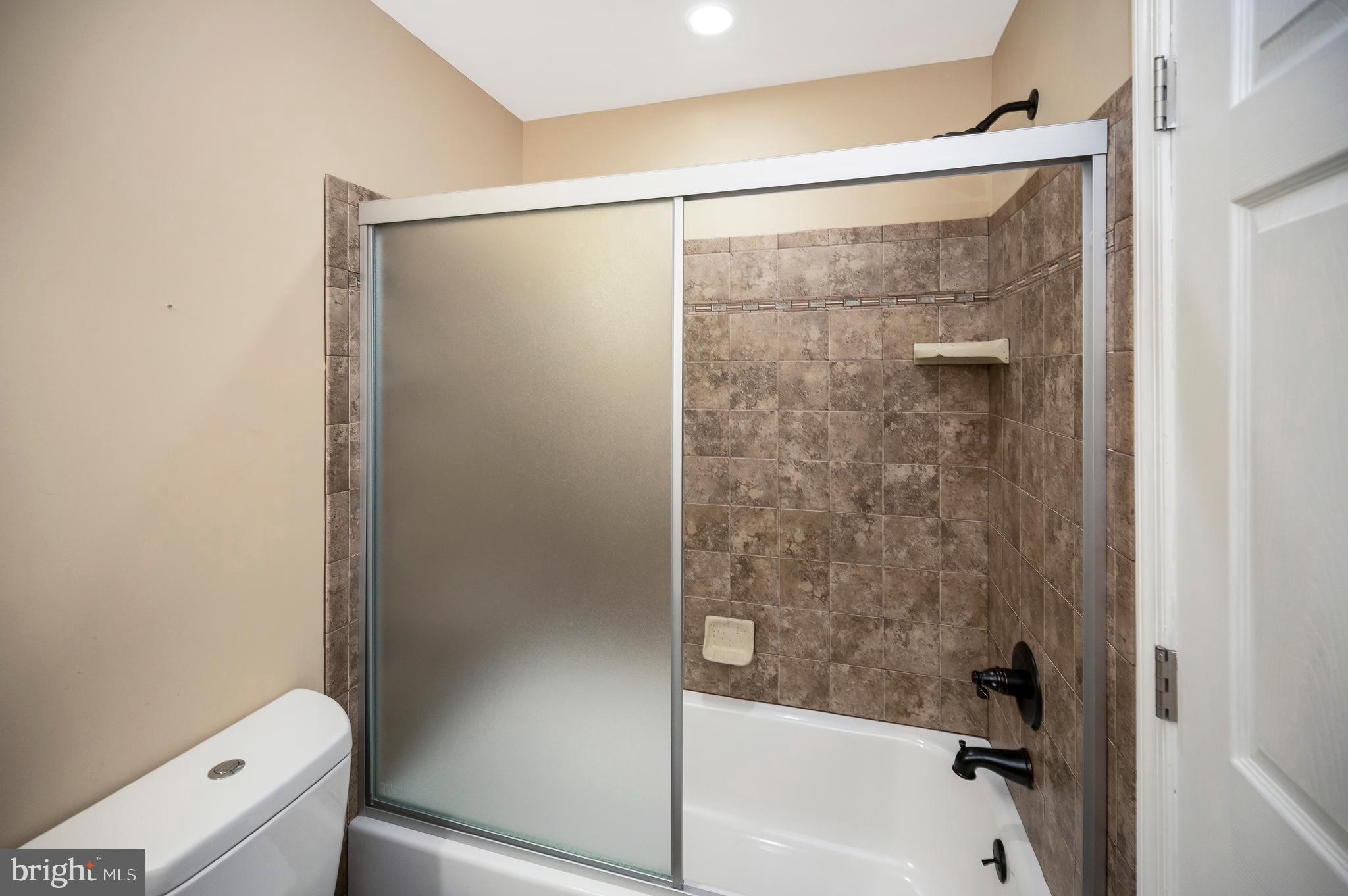 3308 Boathouse Road Warrenton, VA 20187 - Photo 43 of 59 a bathroom with a shower and a toilet
