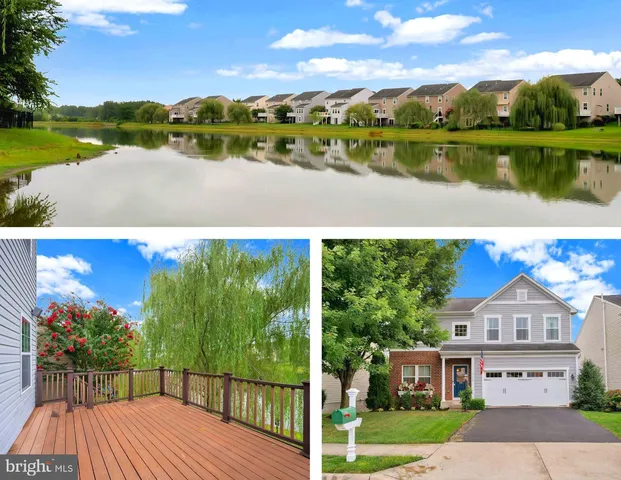 a view of a lake with houses in the back