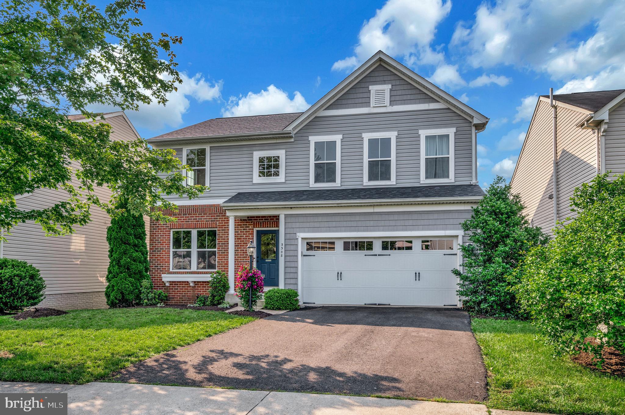 3308 Boathouse Road Warrenton, VA 20187 - Photo 46 of 59 a front view of a house with a yard and garage
