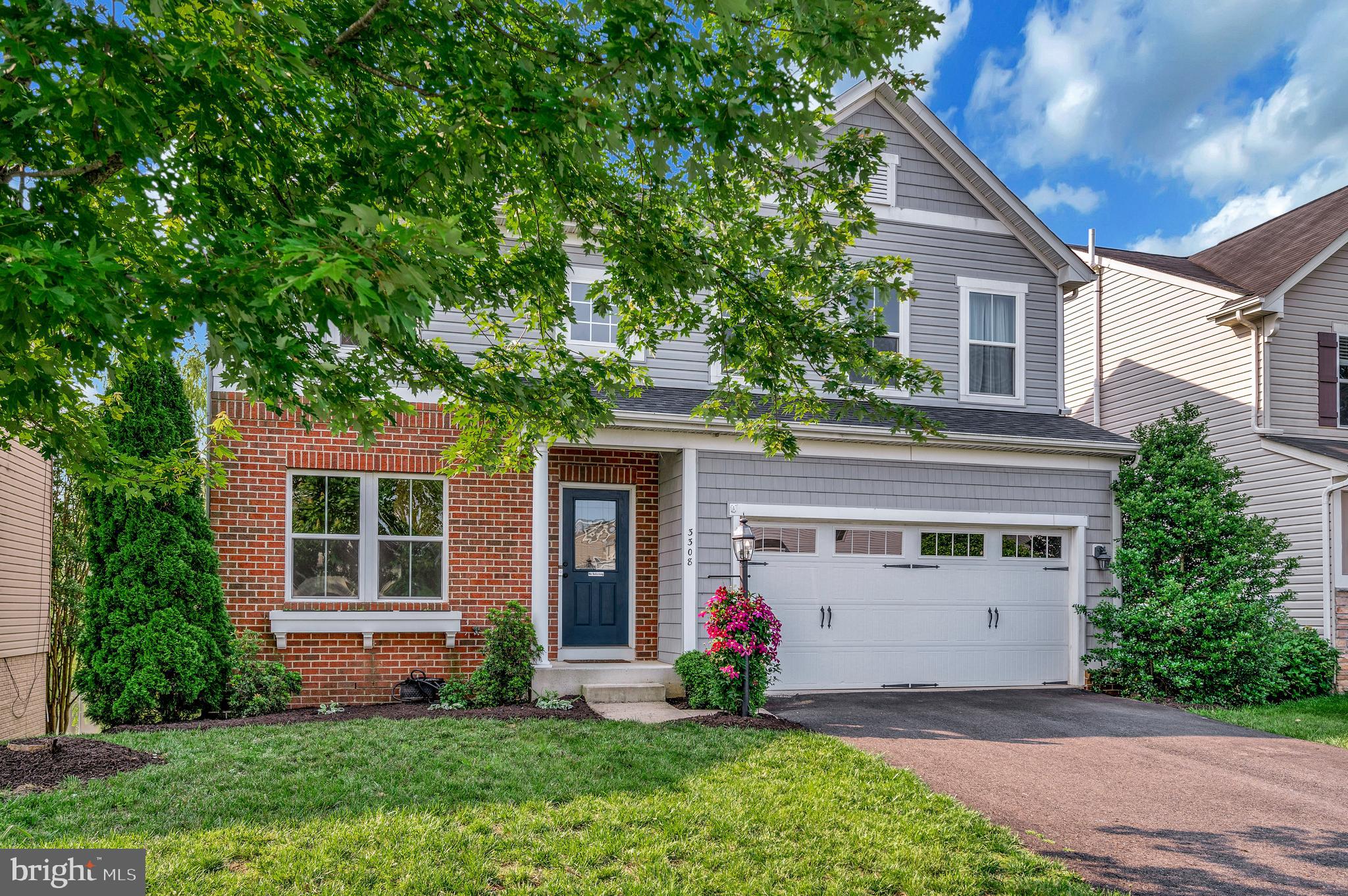 3308 Boathouse Road Warrenton, VA 20187 - Photo 47 of 59 a front view of a house with a yard and garage