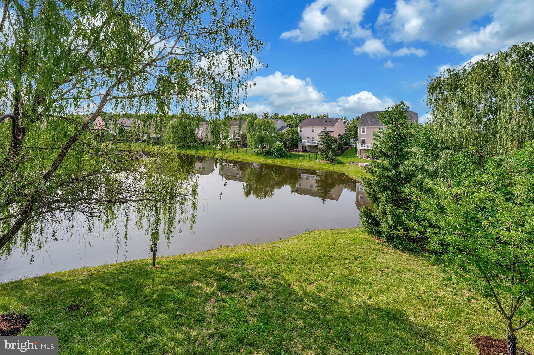 3308 Boathouse Road Warrenton, VA 20187 - Photo 50 of 59 a view of a lake with a garden
