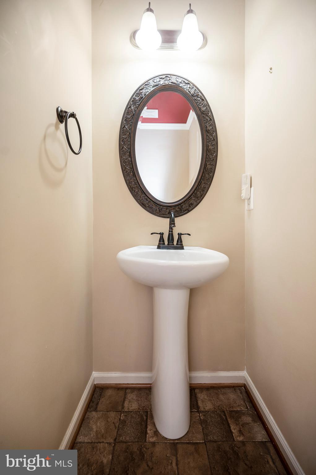 3308 Boathouse Road Warrenton, VA 20187 - Photo 7 of 59 a bathroom with a sink toilet and a mirror