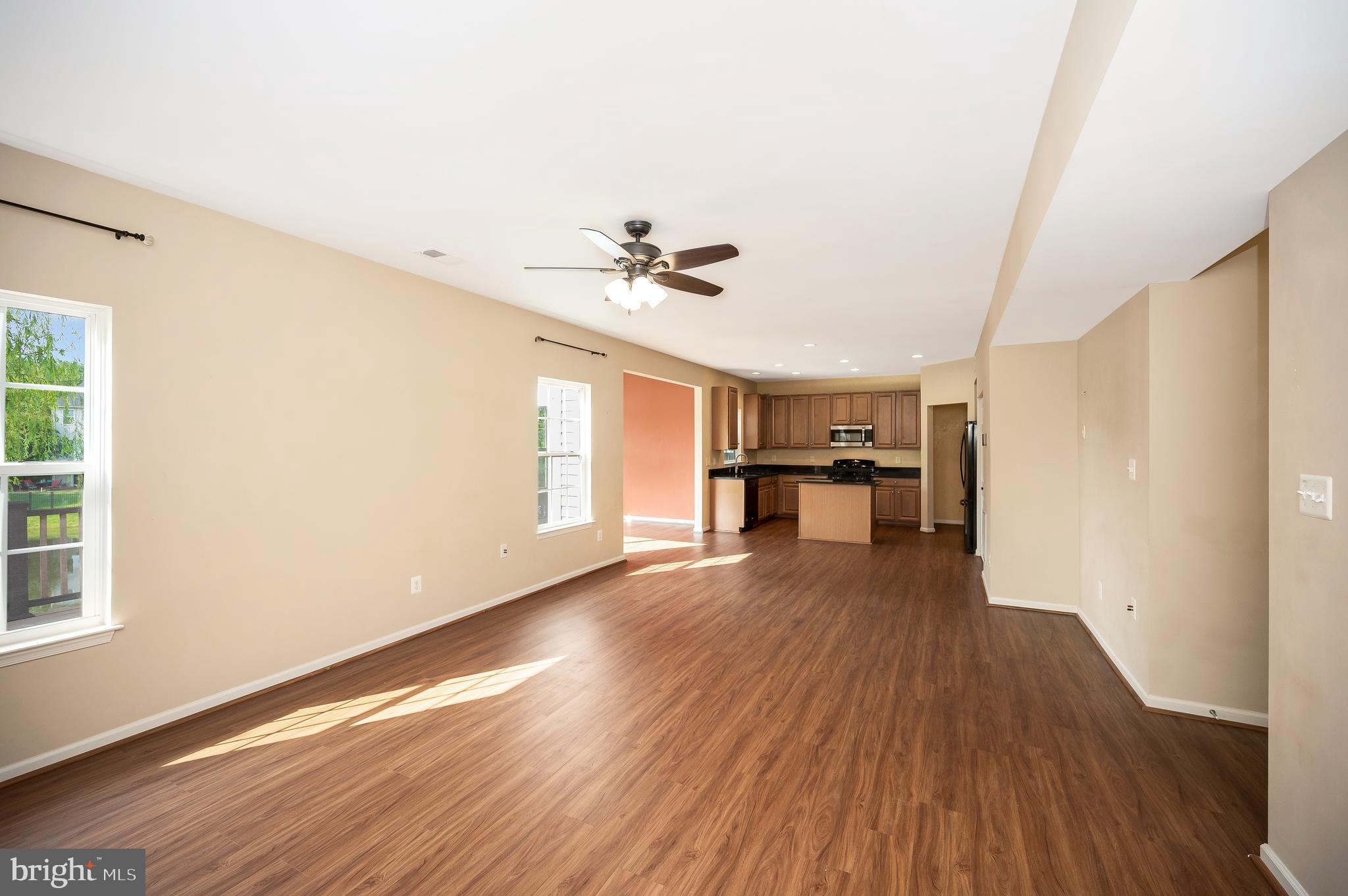 3308 Boathouse Road Warrenton, VA 20187 - Photo 10 of 59 a view of empty room with wooden floor and fan