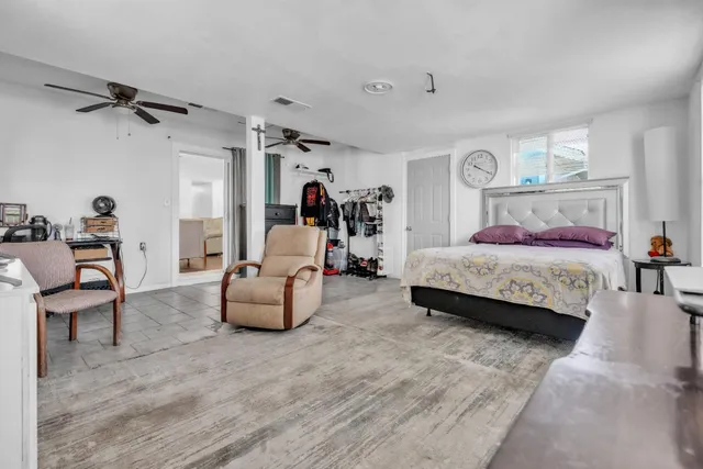 a bedroom with bed and window