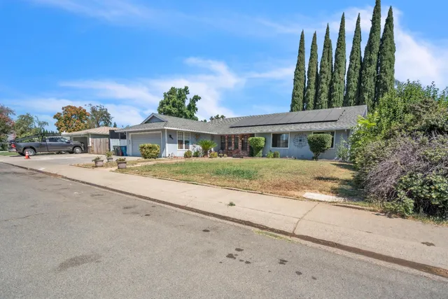 front view of a house with a garden