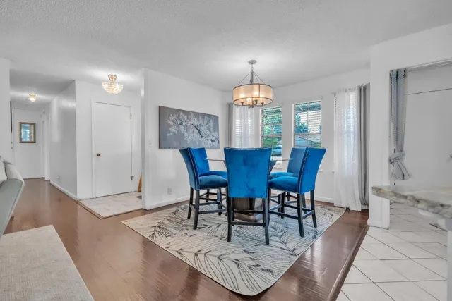 a view of a dining room with furniture and window