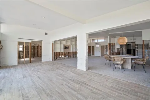 a view of dining room with furniture and wooden floor