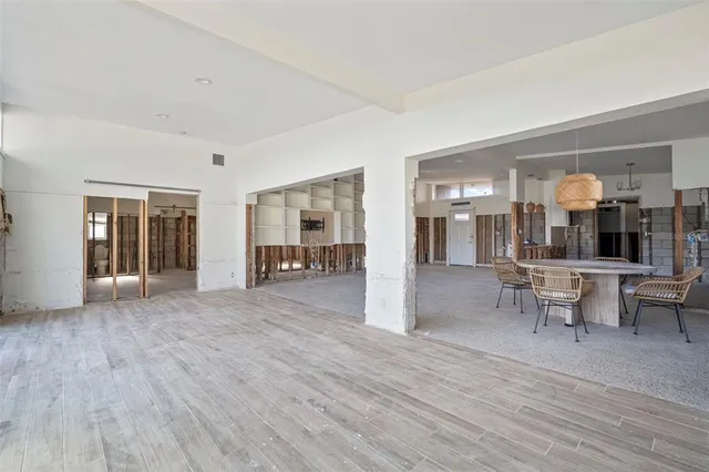 a view of dining room with furniture and wooden floor