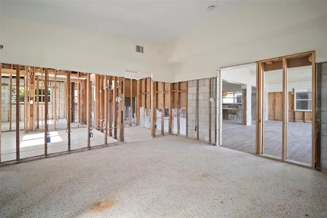 a view of an empty room with windows