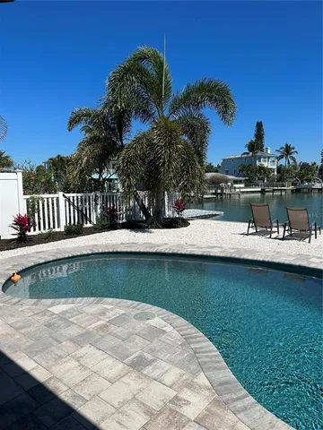 a view of a swimming pool with a lake view