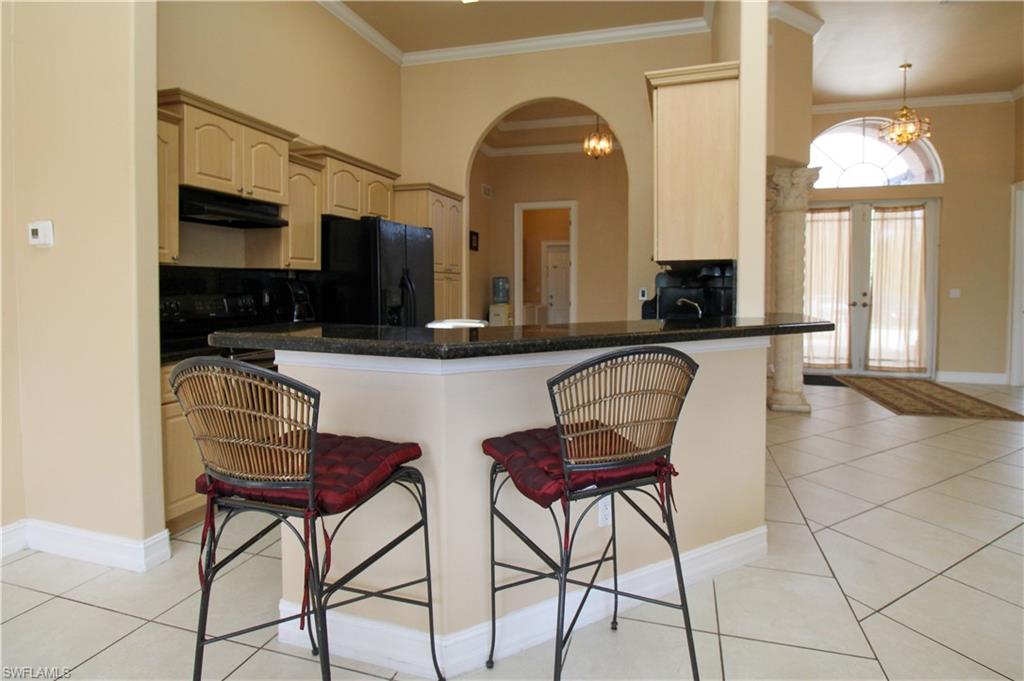 2310 2nd Avenue Southeast Naples, FL 34117 - Photo 16 of 43 a view of a livingroom with furniture and a fireplace