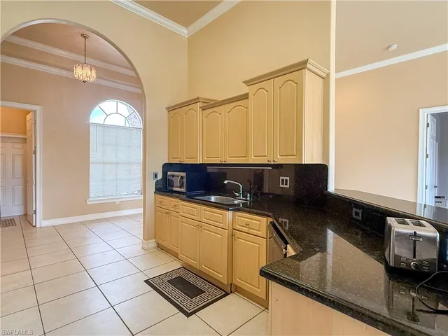 a kitchen with stainless steel appliances a refrigerator stove and microwave