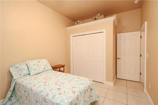 a view of a closet area with wooden floor