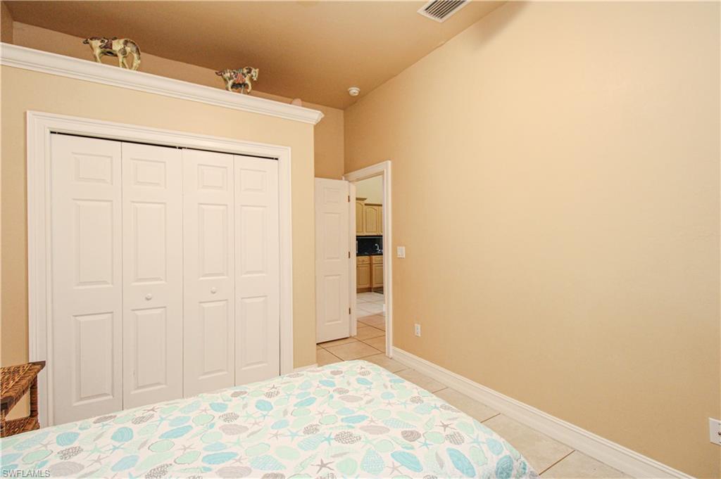 2310 2nd Avenue Southeast Naples, FL 34117 - Photo 23 of 43 a view of a closet area with wooden floor