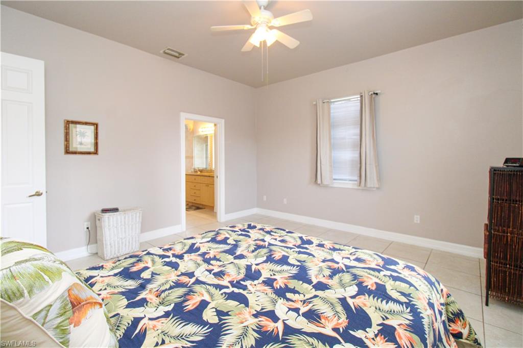 2310 2nd Avenue Southeast Naples, FL 34117 - Photo 27 of 43 a bedroom with bed and window
