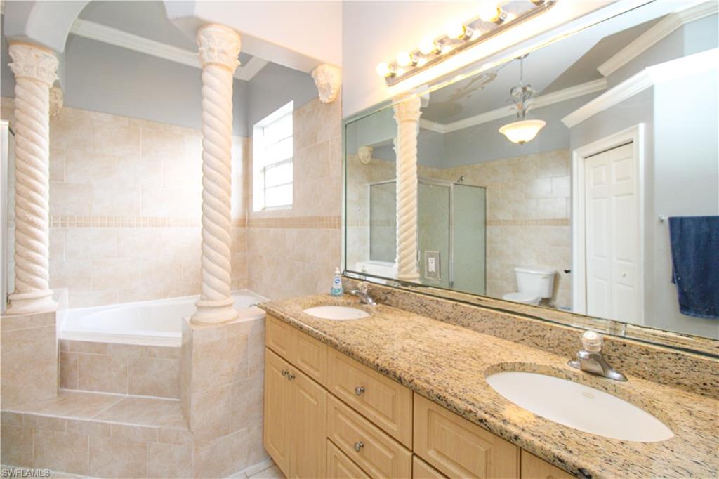 2310 2nd Avenue Southeast Naples, FL 34117 - Photo 29 of 43 a bathroom with a granite countertop sink mirror and a