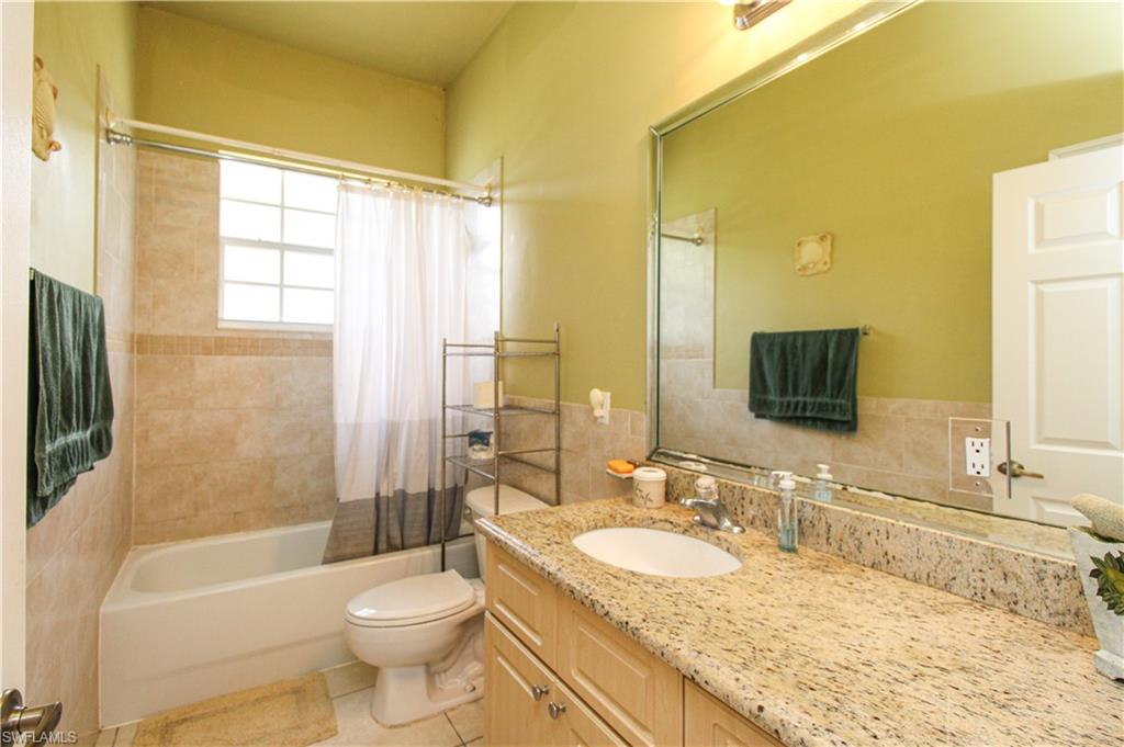 2310 2nd Avenue Southeast Naples, FL 34117 - Photo 33 of 43 a bathroom with a granite countertop sink toilet and shower
