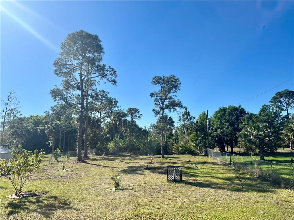 2310 2nd Avenue Southeast Naples, FL 34117 - Photo 41 of 43 a view of a swimming pool with a yard