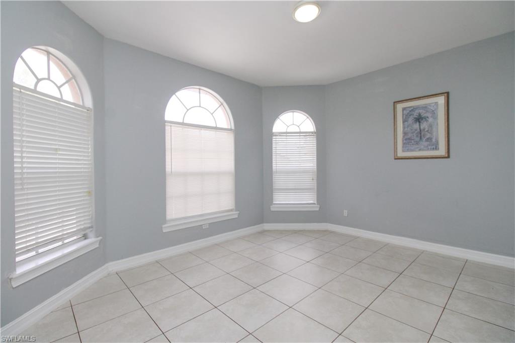 2310 2nd Avenue Southeast Naples, FL 34117 - Photo 8 of 43 an empty room with windows