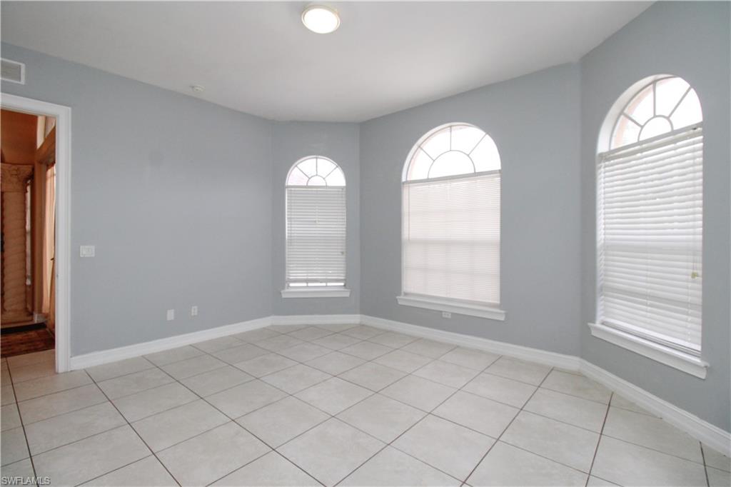 2310 2nd Avenue Southeast Naples, FL 34117 - Photo 9 of 43 an empty room with windows