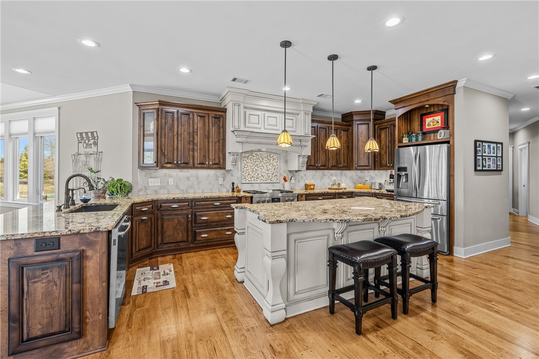 209 Crestridge Drive Seneca, SC 29672 - Photo 10 of 49 This spacious kitchen offers a blend of traditional and modern finishes, perfect for culinary endeavors.