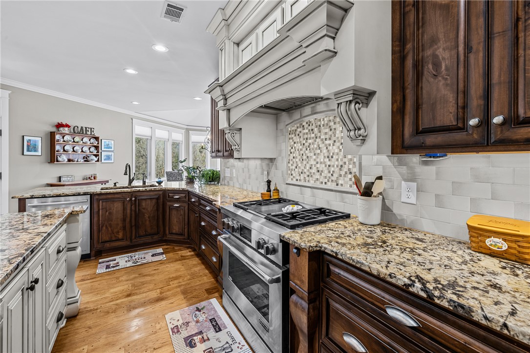 209 Crestridge Drive Seneca, SC 29672 - Photo 13 of 49 This spacious kitchen features ample counter space, rich cabinetry, and a bright, inviting atmosphere.