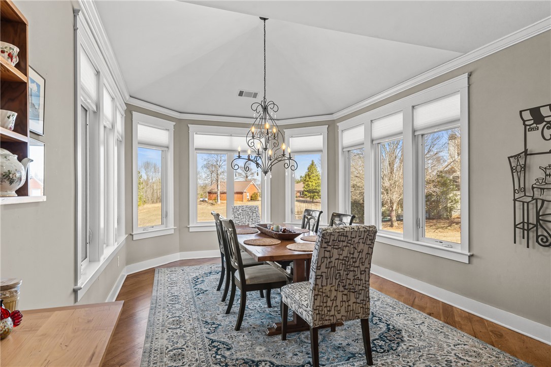 209 Crestridge Drive Seneca, SC 29672 - Photo 16 of 49 This dining area features abundant natural light, creating a bright and inviting atmosphere.
