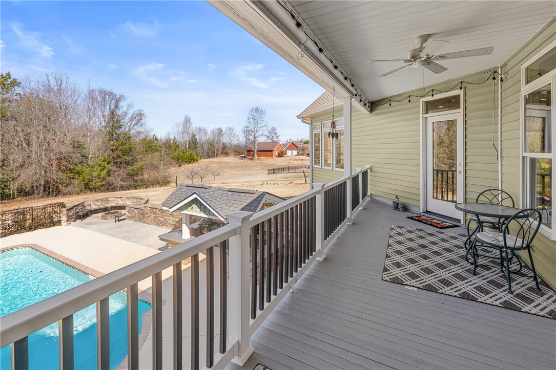 209 Crestridge Drive Seneca, SC 29672 - Photo 19 of 49 Enjoy outdoor living on this elevated deck with scenic views and a sparkling pool below.